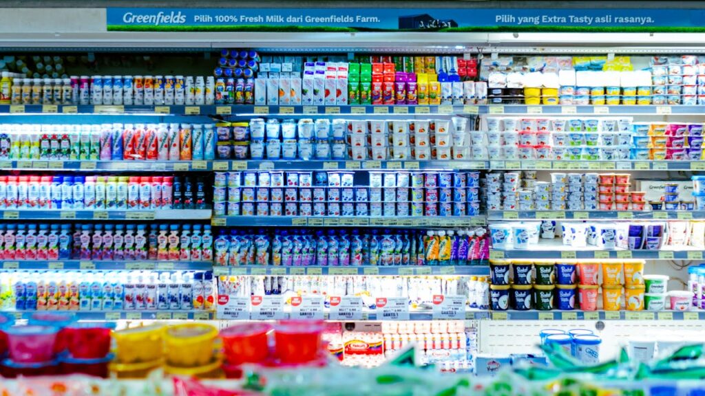 Supermarket fridges storing various beverages for sale