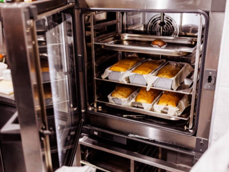 combi oven with trays of baked breads